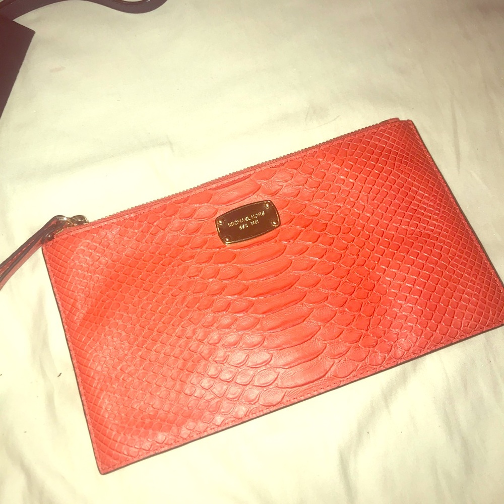 Orange Micheal kors wristlet/wallet